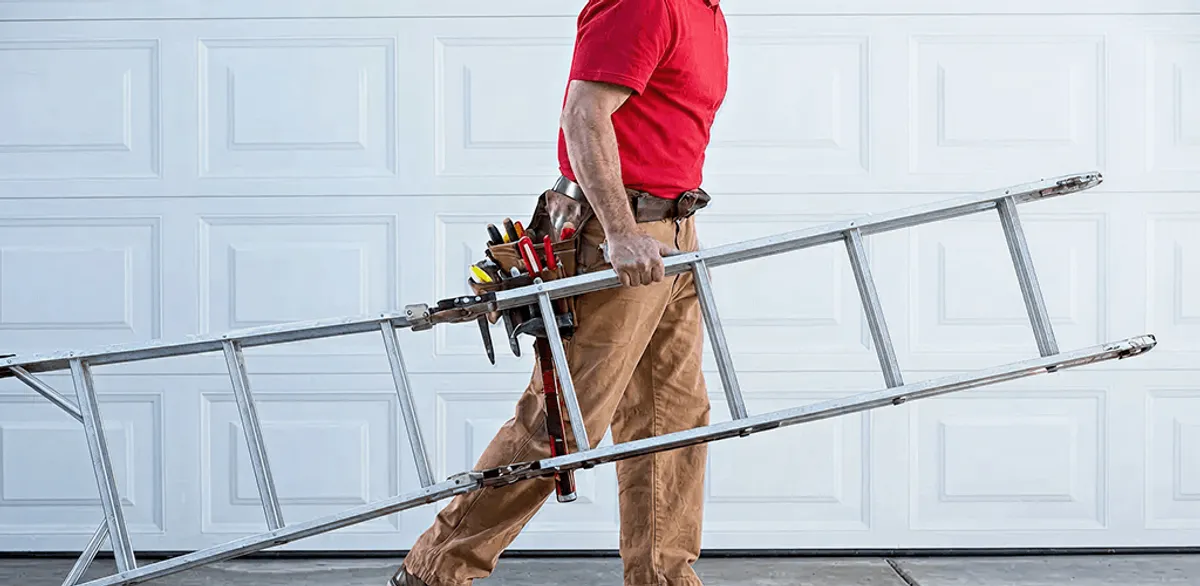 Garage door repair technician arriving with tools and ladder in Savannah, GA